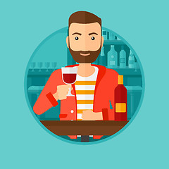 Image showing Man drinking wine at restaurant.