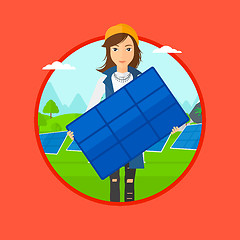 Image showing Woman holding solar panel.