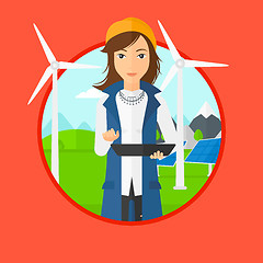 Image showing Female worker of solar power plant and wind farm.