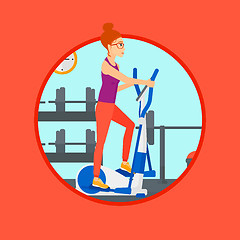 Image showing Woman exercising on elliptical trainer.