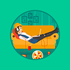 Image showing Woman lying on sofa with many gadgets.