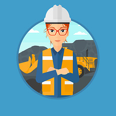 Image showing Miner with a big excavator on background.