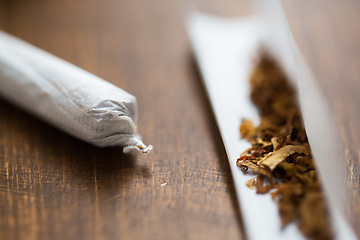 Image showing close up of marijuana joint and tobacco