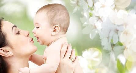 Image showing happy mother kissing adorable baby