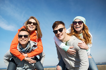 Image showing happy friends in shades having fun outdoors