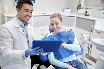 Image showing male dentist with tablet pc and woman patient