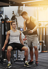 Image showing men exercising on gym machine