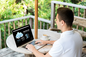 Image showing close up of businessman with laptop on terrace