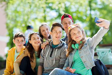 Image showing happy teenage students taking selfie by smartphone