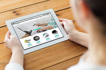 Image showing close up of woman with online shop on tablet pc