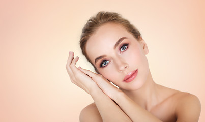 Image showing beautiful young woman face and hands