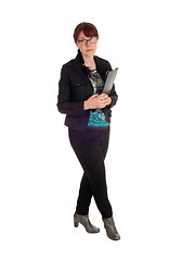 Image showing Businesswoman standing with clipboard.