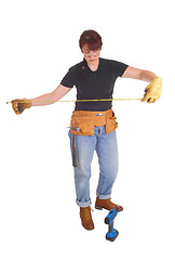 Image showing A handy woman measuring for work.