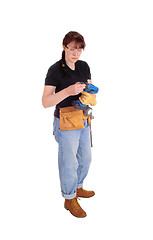 Image showing Woman preparing drill for work.