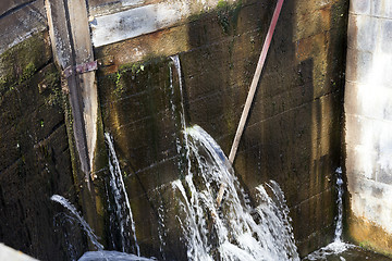 Image showing old leaking dam  