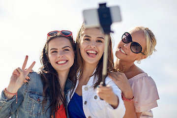 Image showing group of smiling women taking selfie on beach