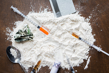 Image showing close up of cocaine drug, money, spoon and syringe