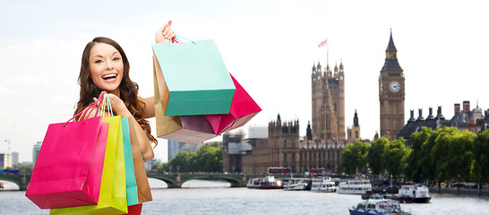 Image showing woman with shopping bags over london city