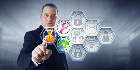 Image showing Businessman Activating Managed Services Icons