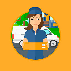 Image showing Delivery woman carrying cardboard boxes.