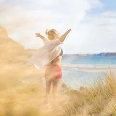 Image showing Free Happy Woman Enjoying Sun on Vacations.