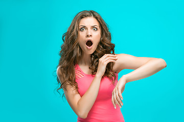 Image showing Portrait of young woman with shocked facial expression