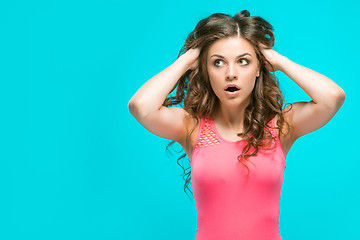 Image showing Portrait of young woman with shocked facial expression