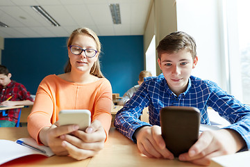 Image showing students with smartphone texting at school