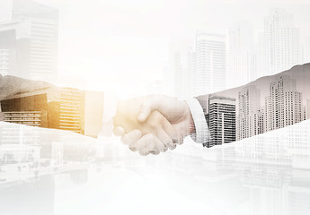 Image showing businessman and businesswoman shaking hands