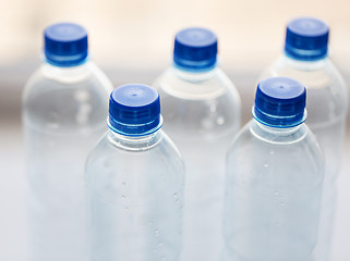 Image showing close up of bottles with drinking water on table