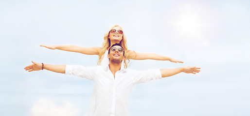 Image showing couple holding hands up at sea side