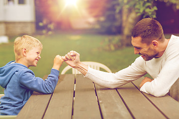 Image showing happy family in front of house outdoors