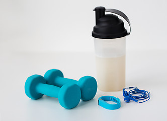 Image showing dumbbells, tracker, earphones and bottle