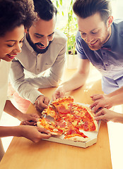 Image showing happy business team eating pizza in office