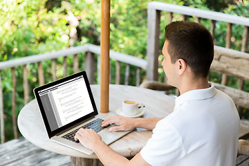 Image showing close up of businessman with laptop on terrace
