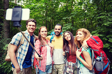 Image showing friends with backpack taking selfie by smartphone