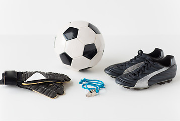 Image showing close up of soccer ball, gloves, whistle and boots