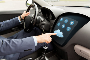 Image showing close up of man driving car with menu on computer