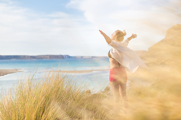 Image showing Free Happy Woman Enjoying Sun on Vacations.