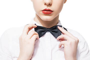 Image showing Close up portrait of  young woman in white shirt and bow tie with red lipstick 