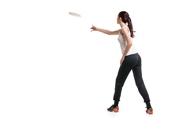 Image showing young happy woman playing with flying disc