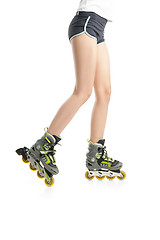 Image showing Close up  picture of woman\'s legs with rollerskates 
