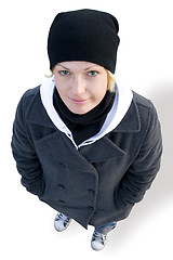 Image showing girl in cap, coat and gym shoes