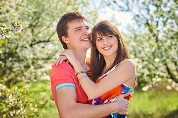 Image showing Young couple enjoying in blooming garden