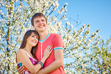 Image showing Young couple enjoying in blooming garden