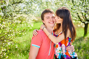 Image showing Young couple enjoying in blooming garden