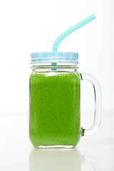 Image showing Jar tumbler mug with green smoothie drink