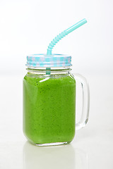 Image showing Jar tumbler mug with green smoothie drink