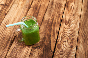 Image showing Jar tumbler mug with green smoothie drink