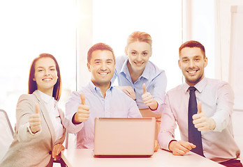 Image showing business team working with laptop in office